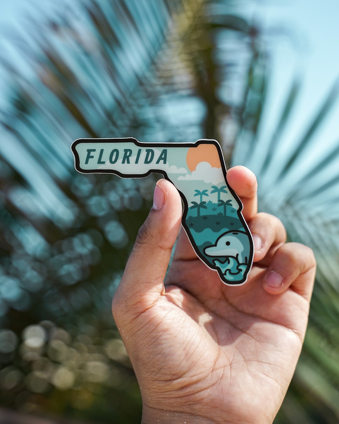 FAQ by Florida Getaways person holding white and black iphone case