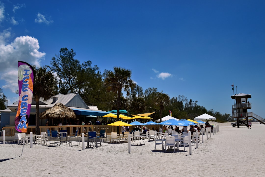 FAQ: Your Burning Questions Answered by Florida Getaways A beachfront restaurant with umbrellas and lifeguard tower.