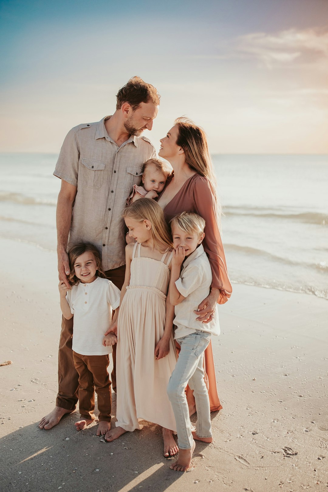 🎉 Conclusion: Your Florida Family Adventure Awaits! by Florida Getaways a family posing on a beach